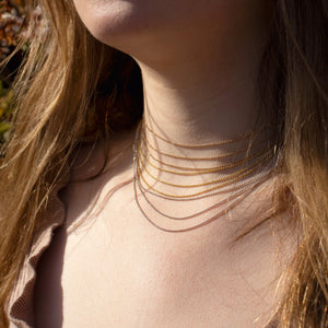 three Chai necklaces layered