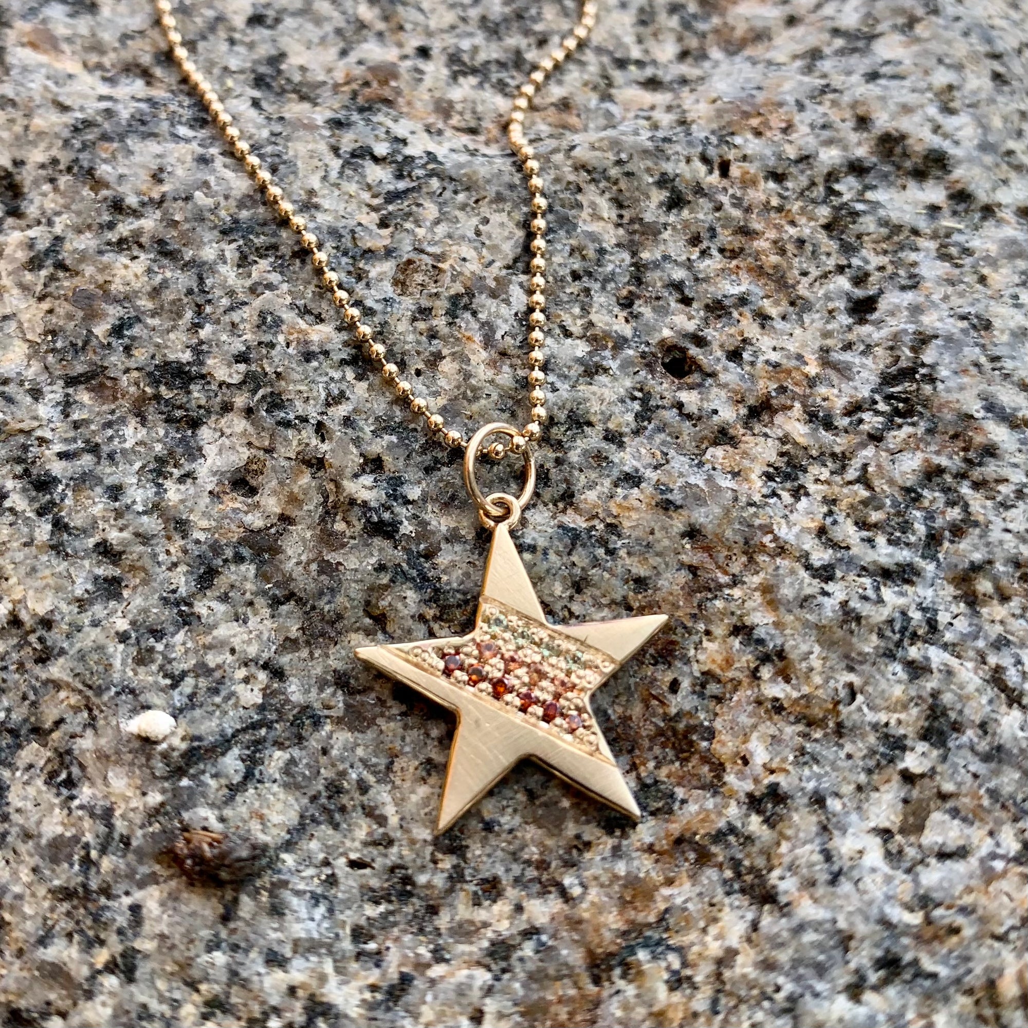 14k gold HAWK star charm with sapphires