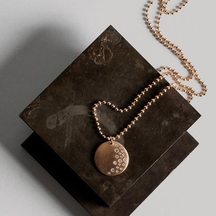 14k rose gold x-large MINA medallion with scattered diamonds in studio mimage