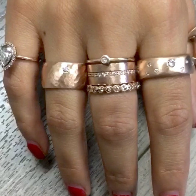 14k rose gold RAMA wide hammered band ring with white diamond on model with RANI and REND rings